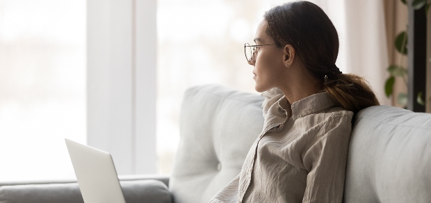 woman looking out the window