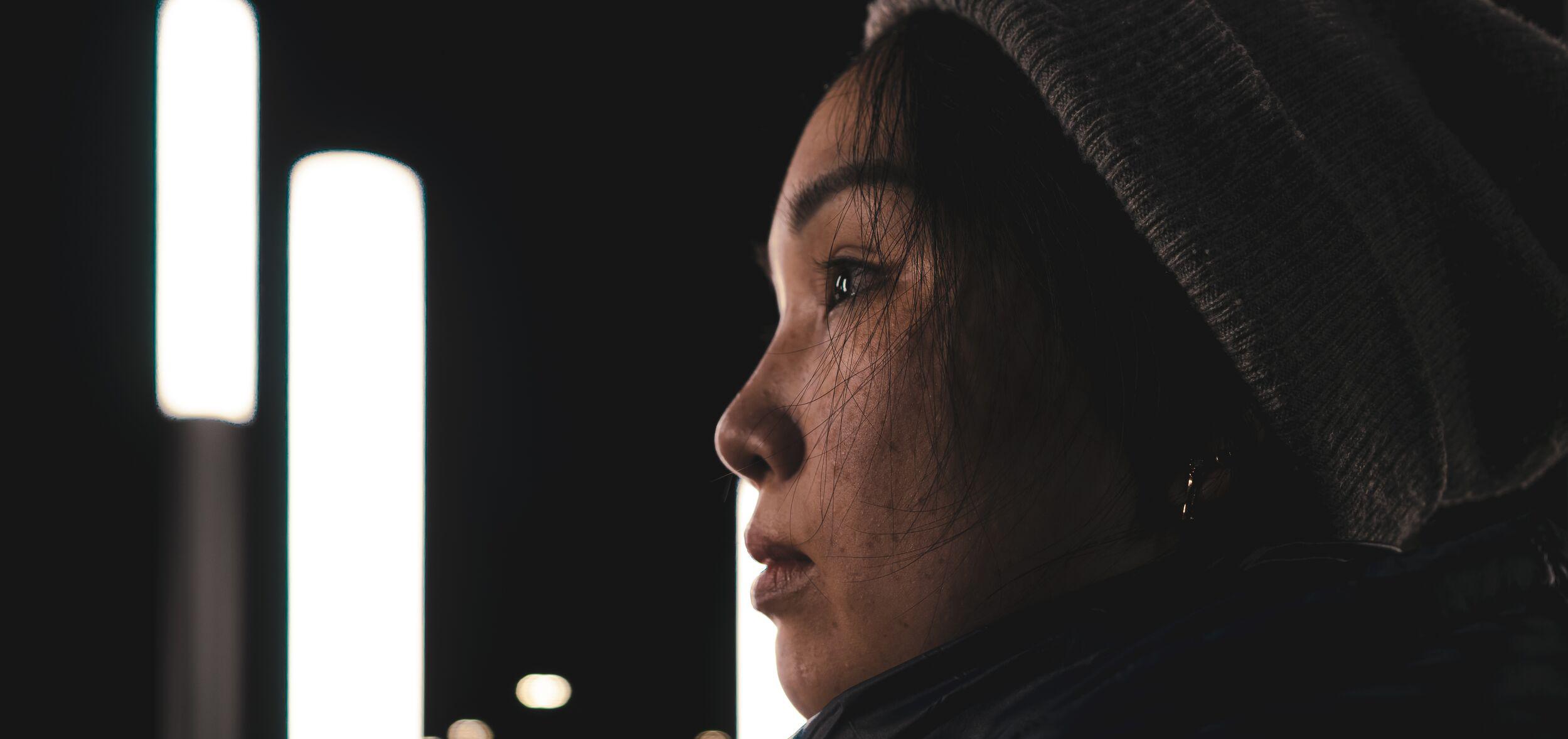 pensive woman looking far off into the distance