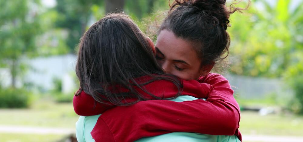 two women hugging