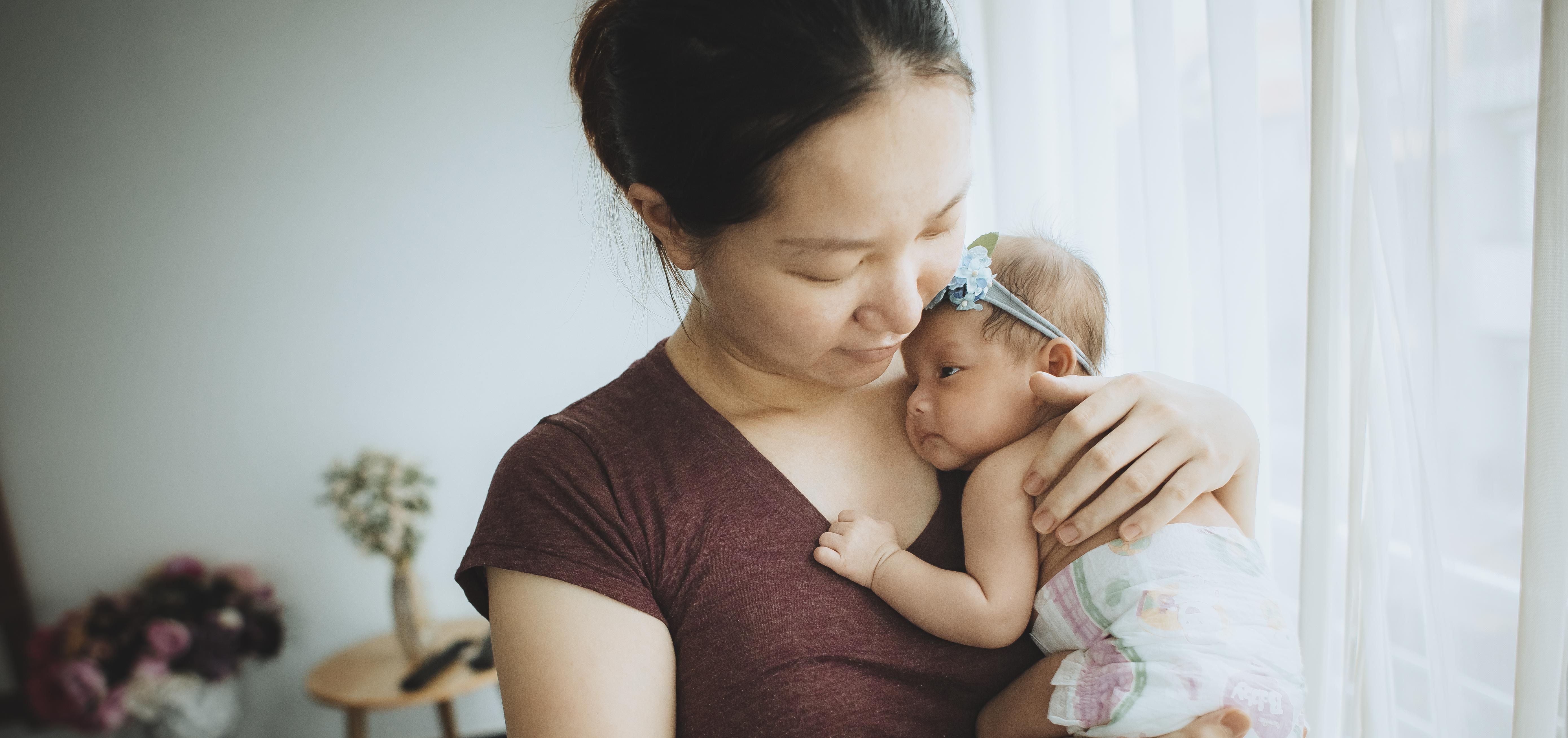 mother holding her baby