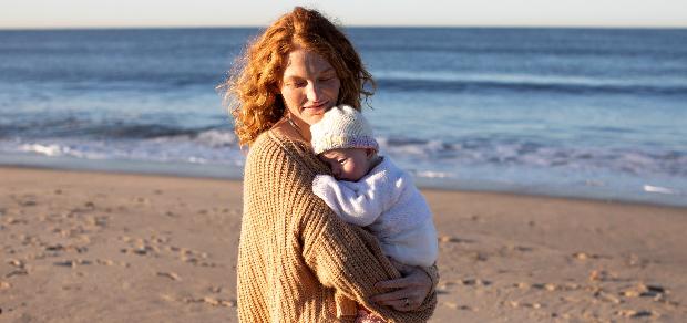 mom with baby at the beach