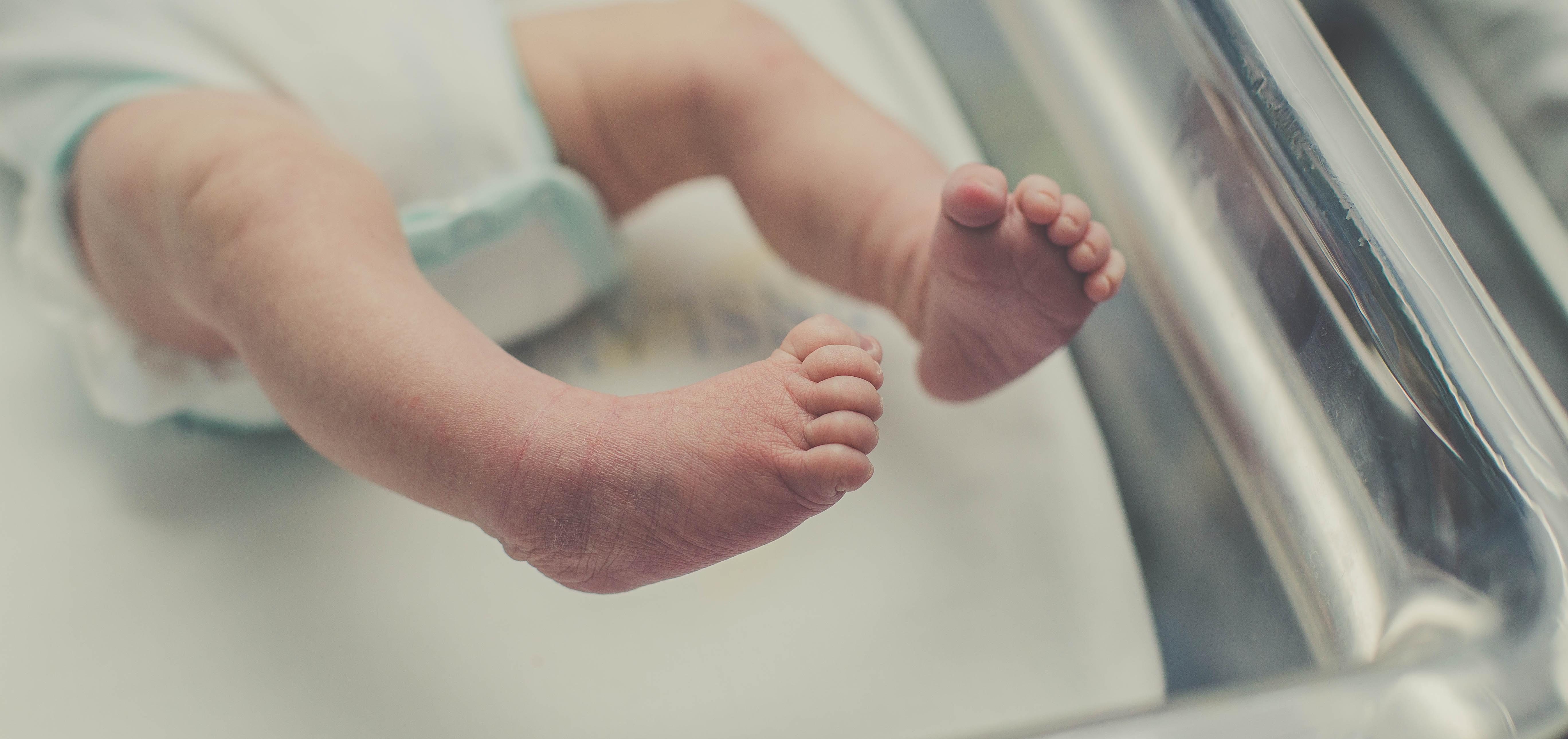 Baby feet in a crib. 