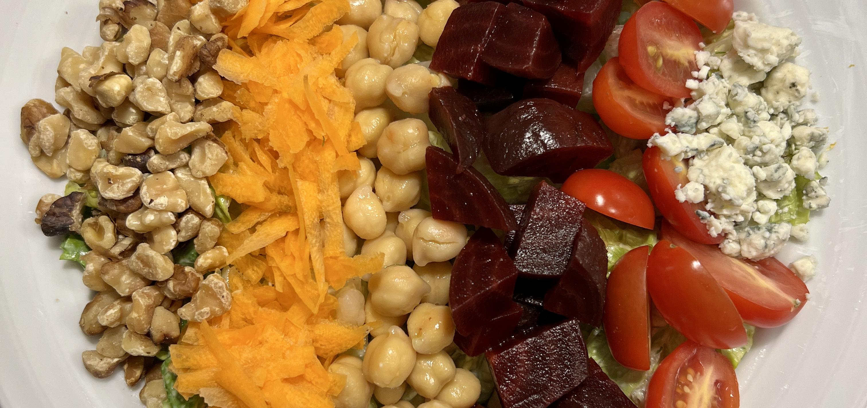 Vegetarian Cobb salad, arranged in neat rows of colorful vegetables