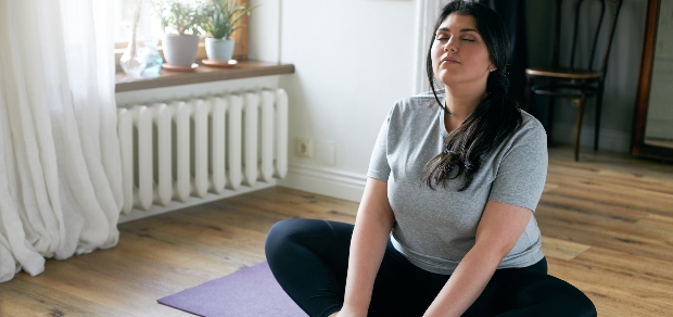 woman doing yoga at home